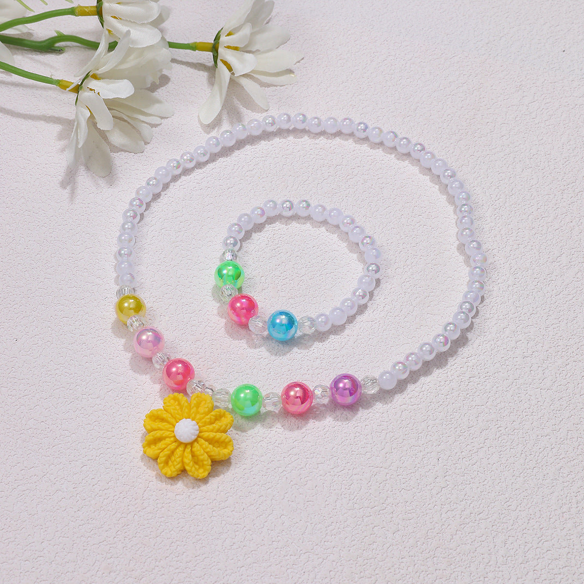 Set di gioielli giocosi con ciondolo a fiore