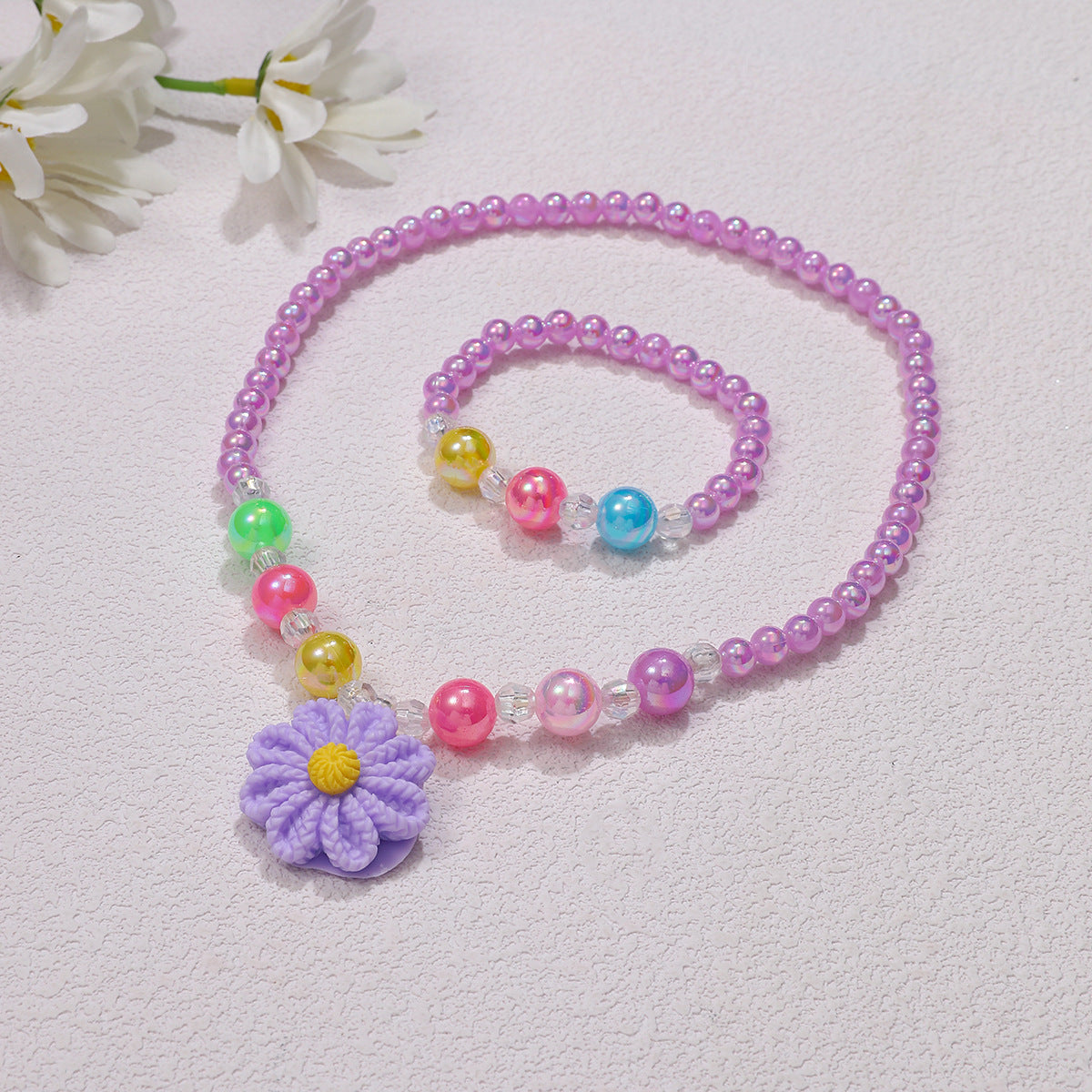 Set di gioielli giocosi con ciondolo a fiore
