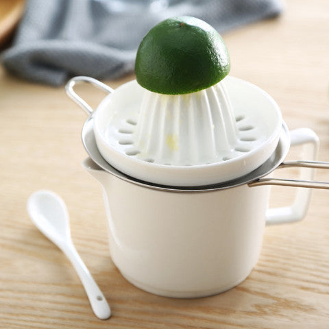Spremiagrumi manuale con bicchiere integrato