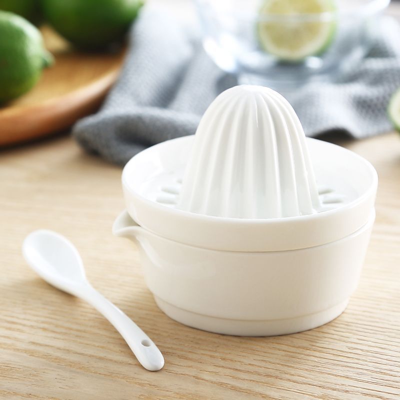 Spremiagrumi manuale con bicchiere integrato