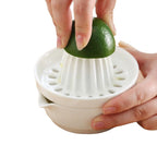 Spremiagrumi manuale con bicchiere integrato