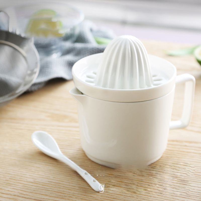 Spremiagrumi manuale con bicchiere integrato